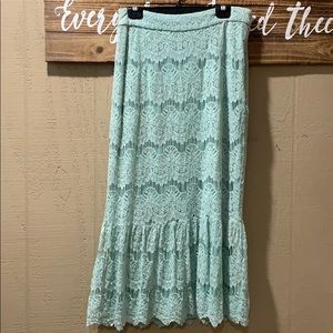 Dainty Jewell’s mint lace skirt.
